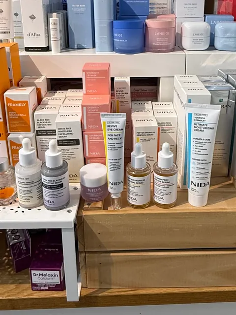 NIDA serums and creams on a store table